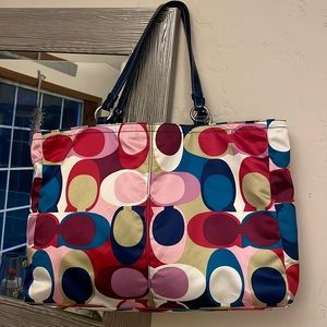 Coach - Multiple jewel tone sateen tote with interior storage.